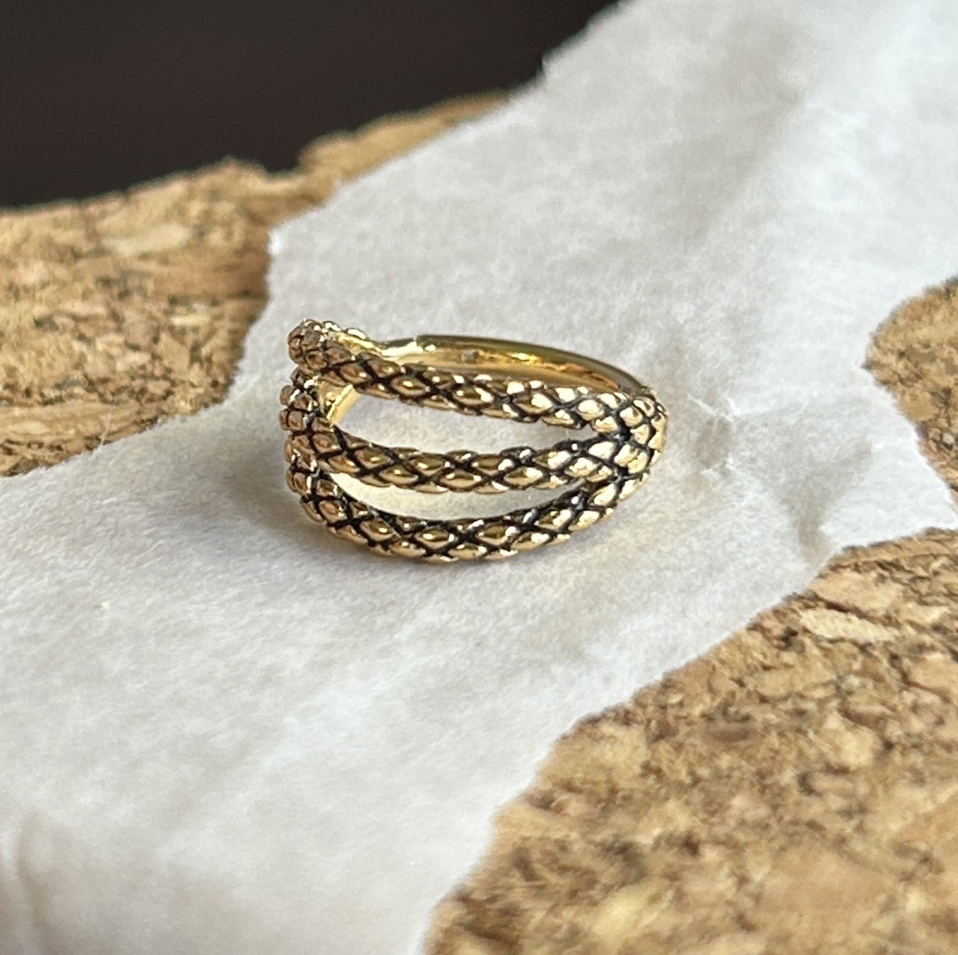 Steel triple clicker in a snake skin pattern