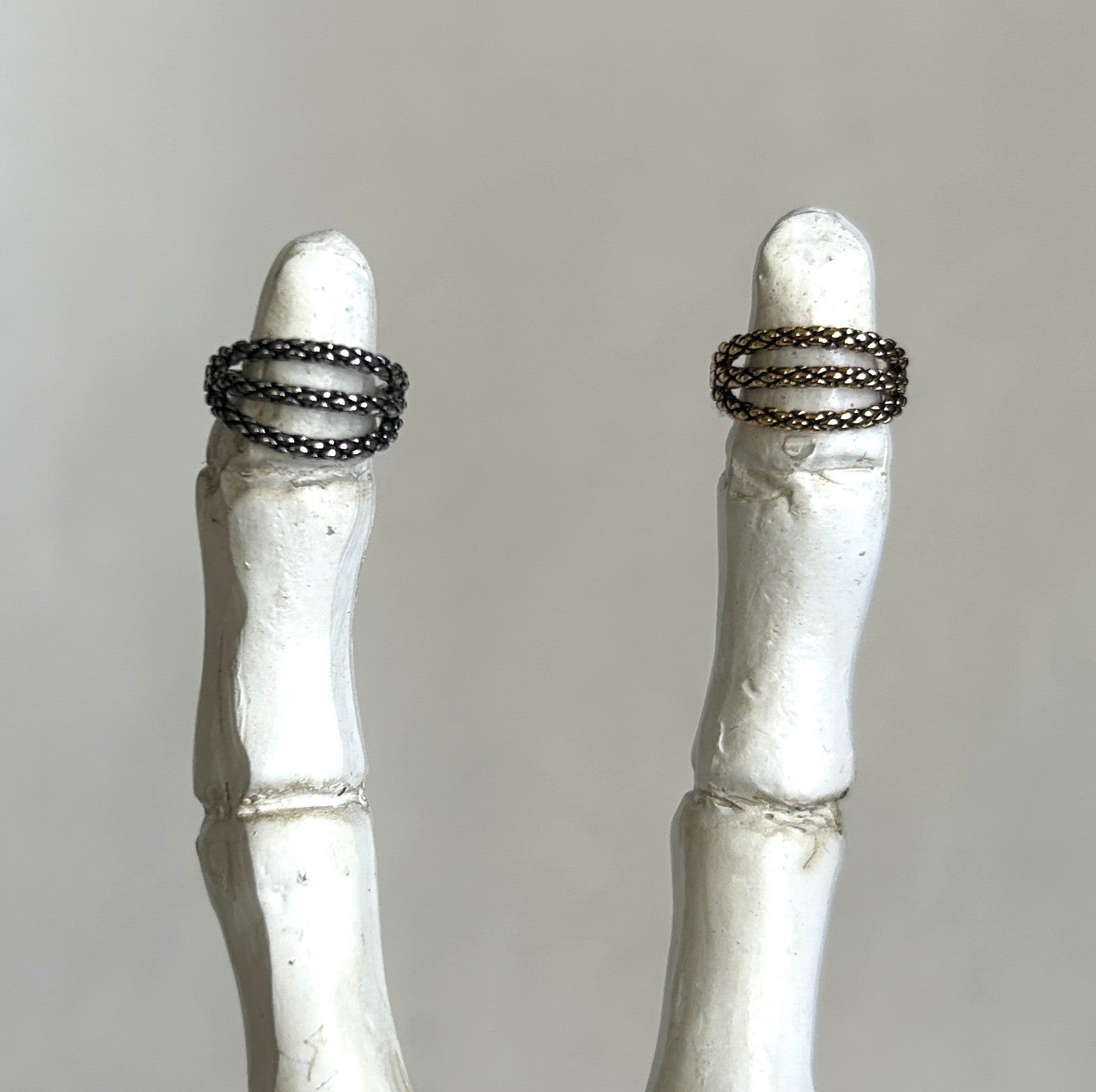Steel triple clicker in a snake skin pattern